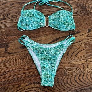 size small bikini set, green and blue floral, top has gold opening in the middle